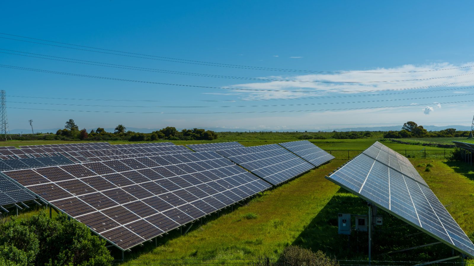 Solar panels in a rural countryside field generating renewable energy
