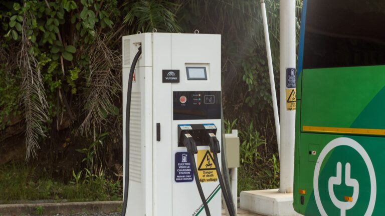 Electric bus plugged into a charging station